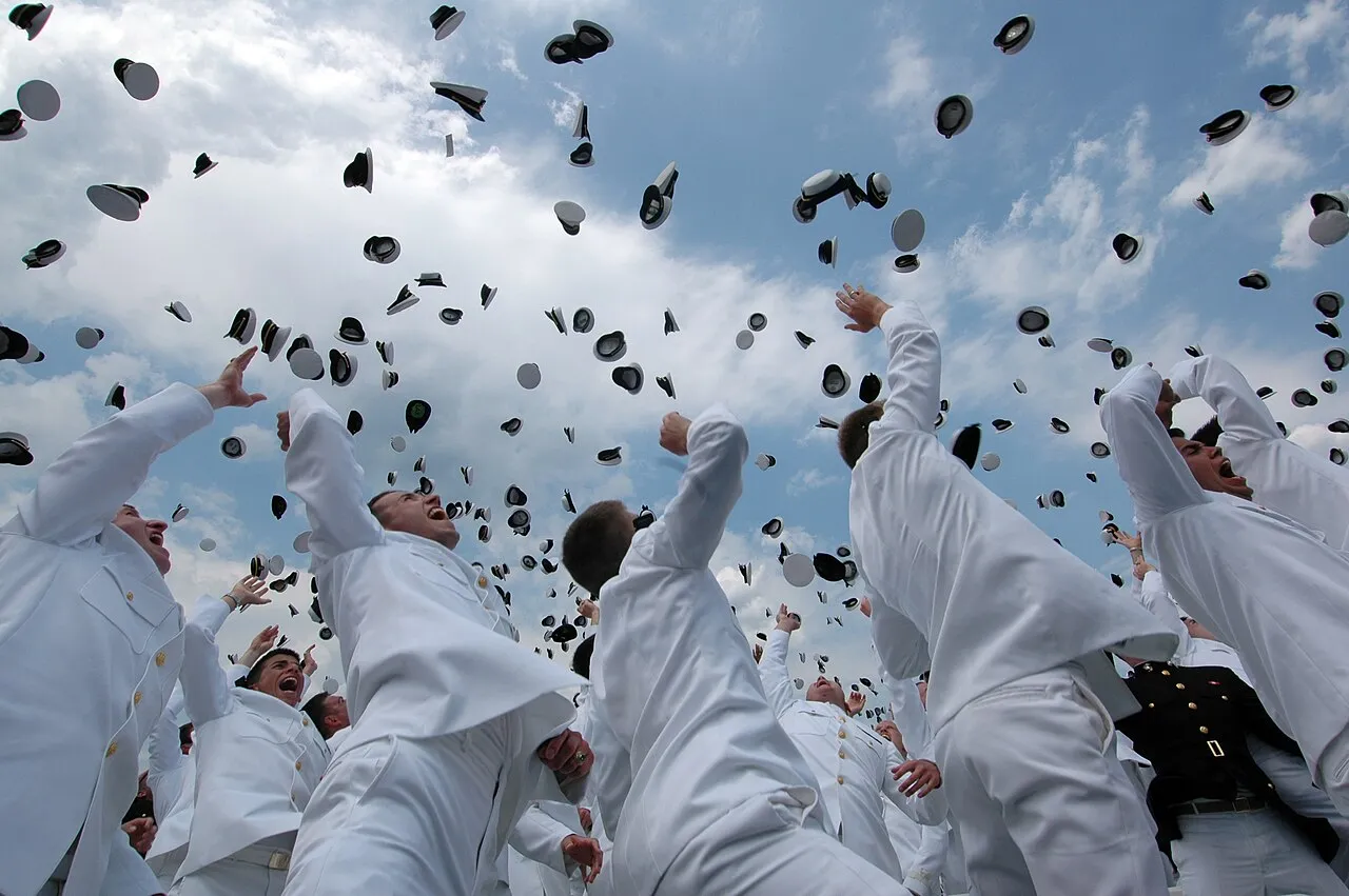 Graduates tossing their caps into the air at a graduation ceremony