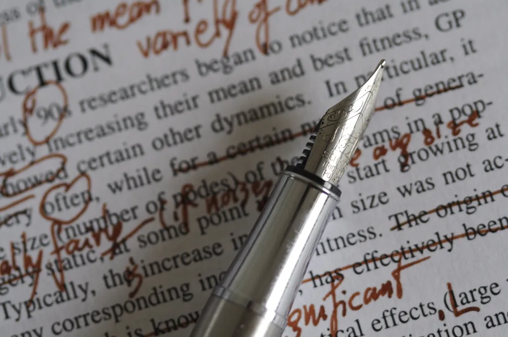 A fountain pen making corrections on a printed document